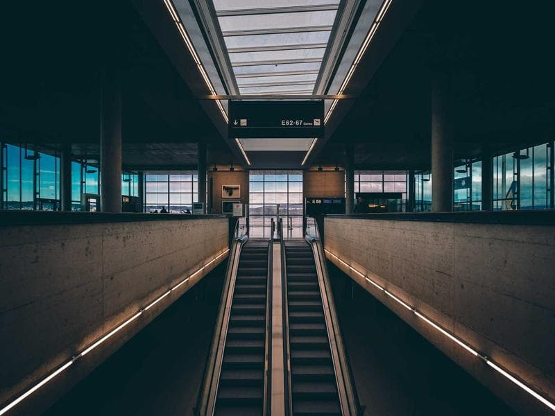 Couple with wedding planner reviewing details at a Sicilian venue