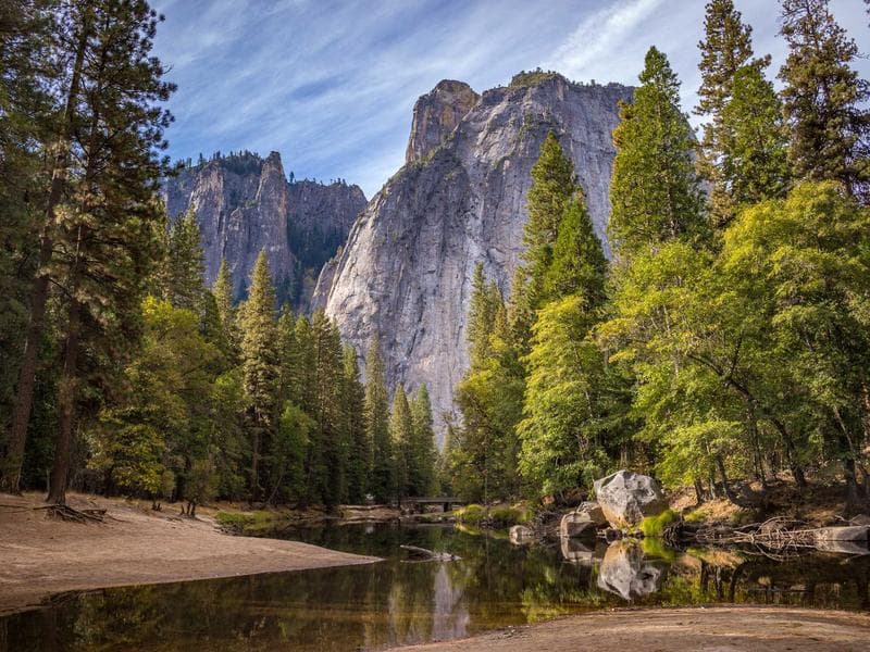 Bride and groom at golden hour overlooking the sea in Taormina