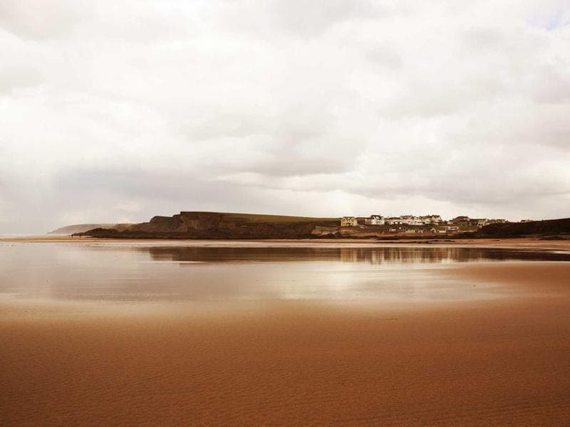 Photographer working with natural window light during a portrait session